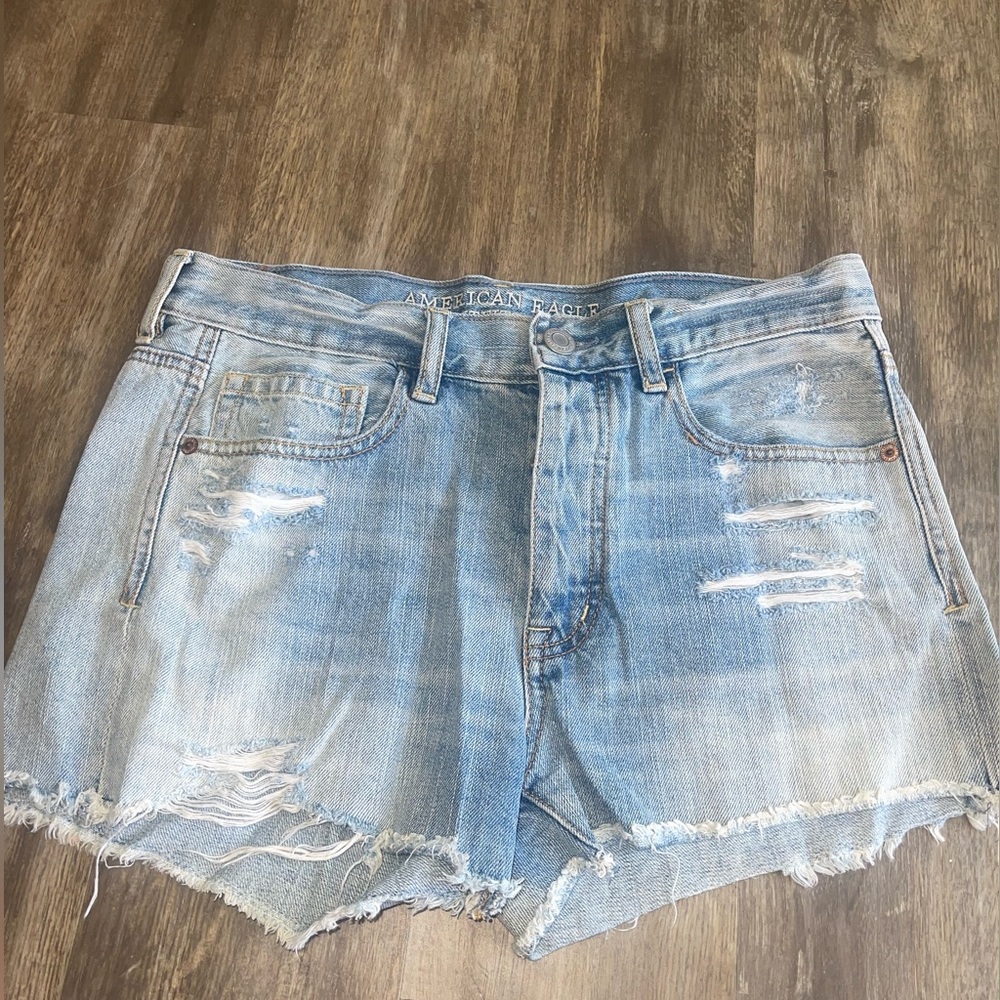American Eagle Outfitters distressed light denim shorts.